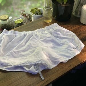 White Nike running shorts